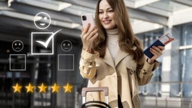 A lady looking at her mobile, smiling, and 5 stars marked on screen as rating.