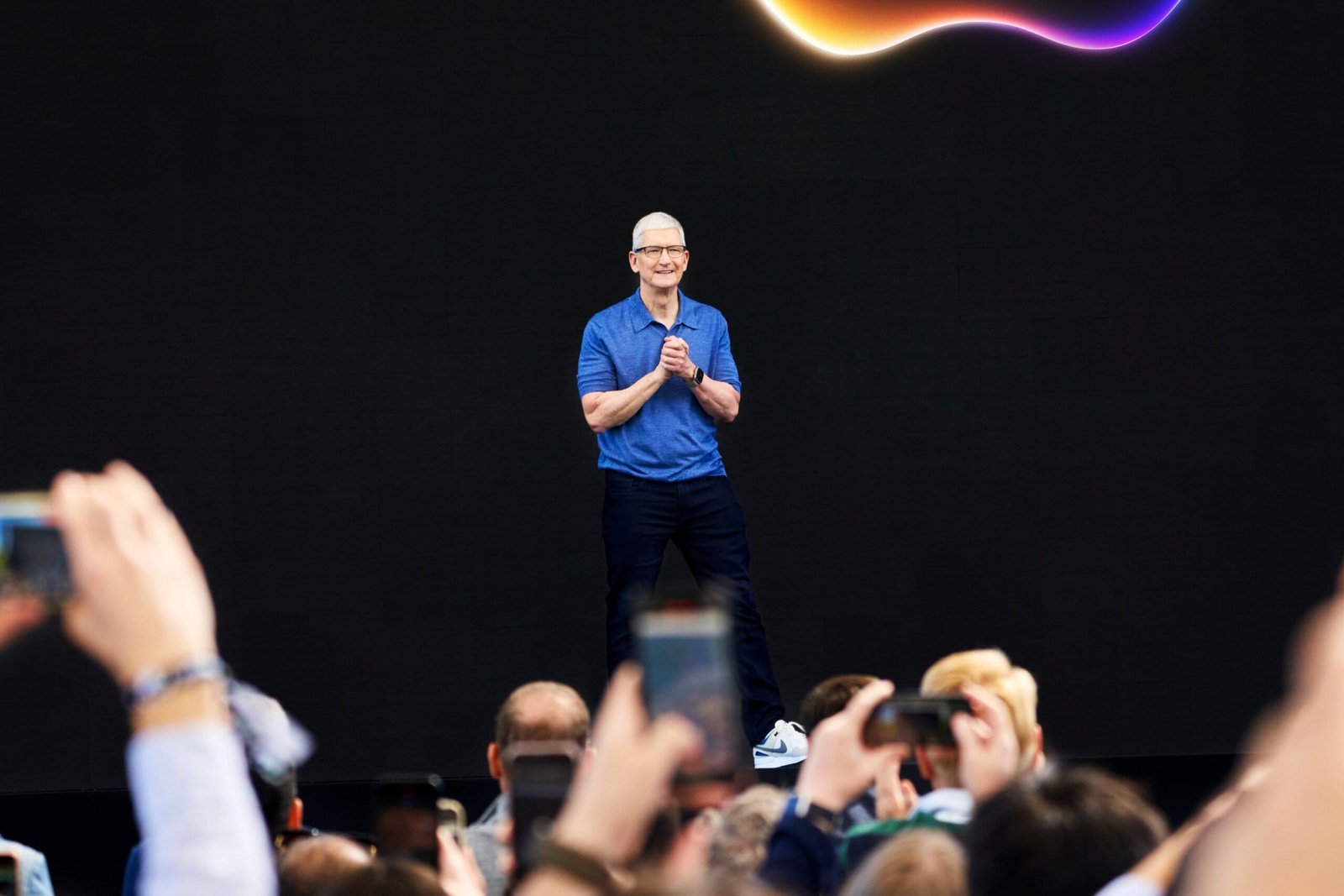 Tim Cook greets the audience ahead of the keynote event at WWDC24