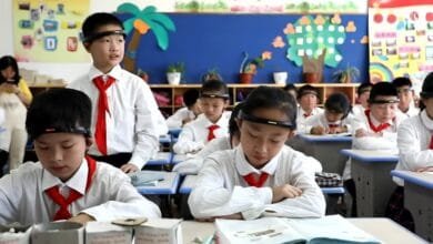 A Classroom in China where students are wearing like BCI headbands (EEG)
