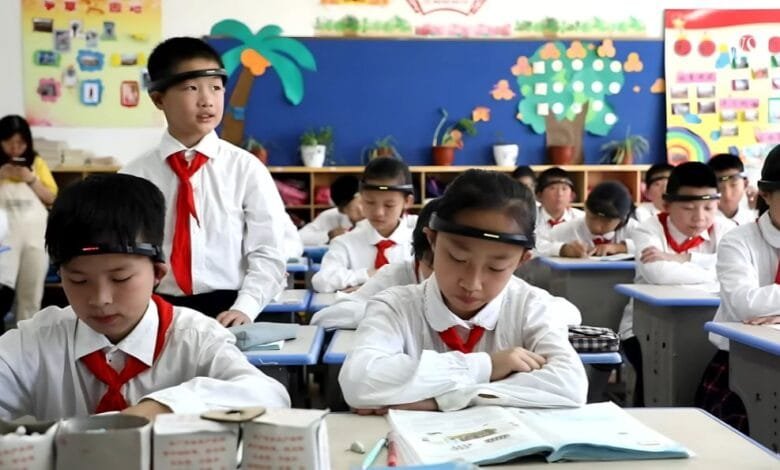 A Classroom in China where students are wearing like BCI headbands (EEG)