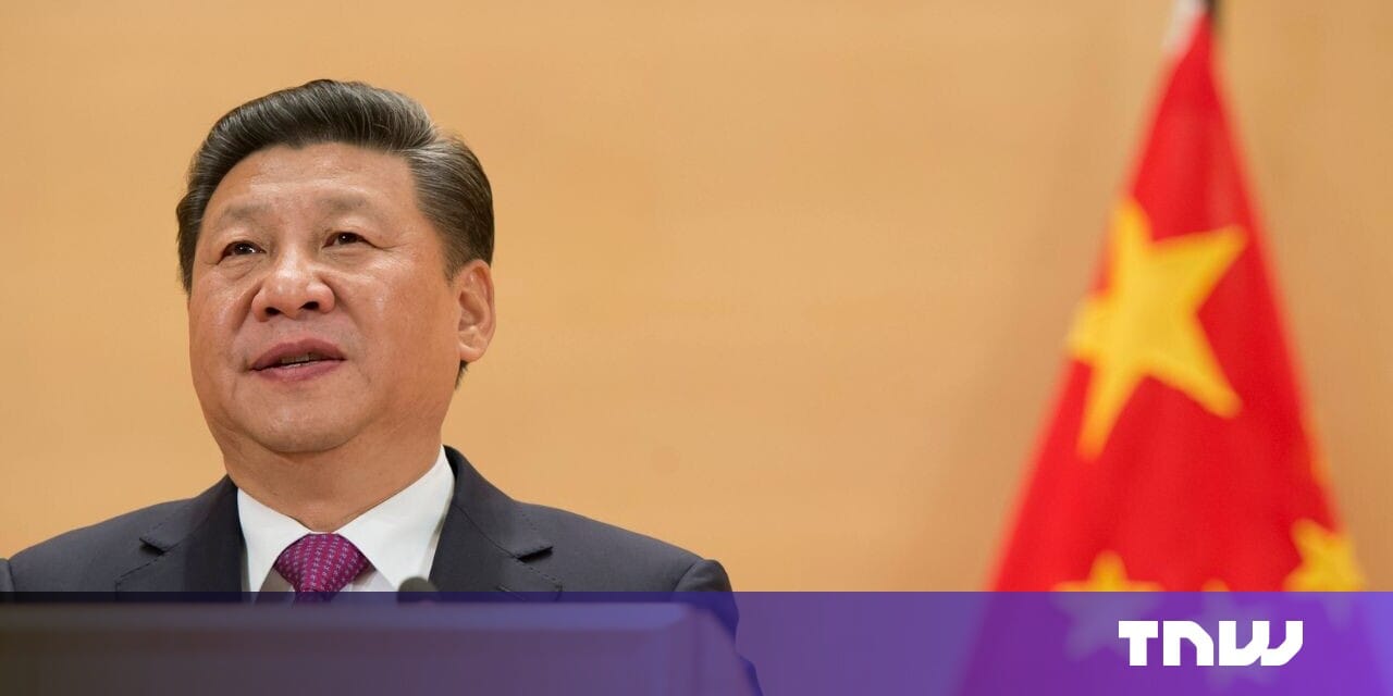 Xi Jinping, President of China, speaks at a podium with a blurred Chinese flag in the background.