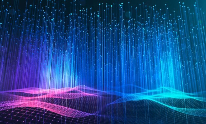 Abstract digital art depicting glowing blue and pink lines forming a wave-like pattern against a dark background.