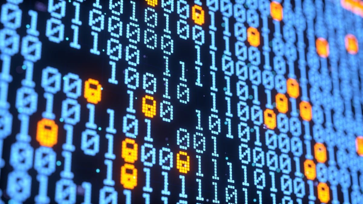 Close-up of a digital screen displaying binary code with glowing orange padlock symbols interspersed, suggesting data security.