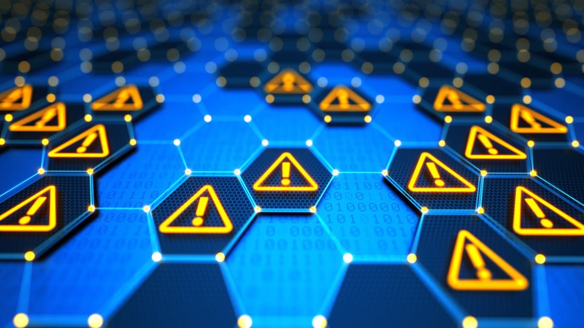 Abstract digital network with glowing hexagonal nodes displaying warning signs, indicating potential system errors or security breaches.