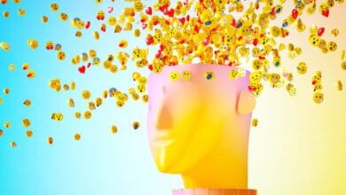 Abstract 3D head with emojis bursting out, representing the overwhelming nature of social media.