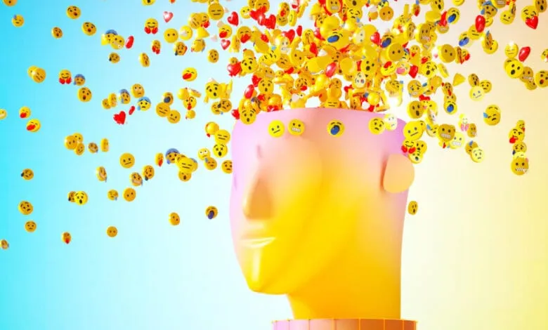 Abstract 3D head with emojis bursting out, representing the overwhelming nature of social media.