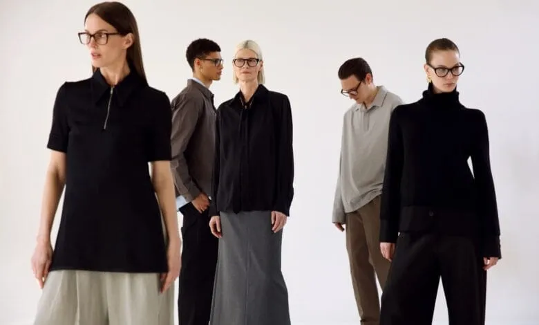 Five stylish individuals, three women and two men, model various outfits and eyeglasses against a white backdrop.