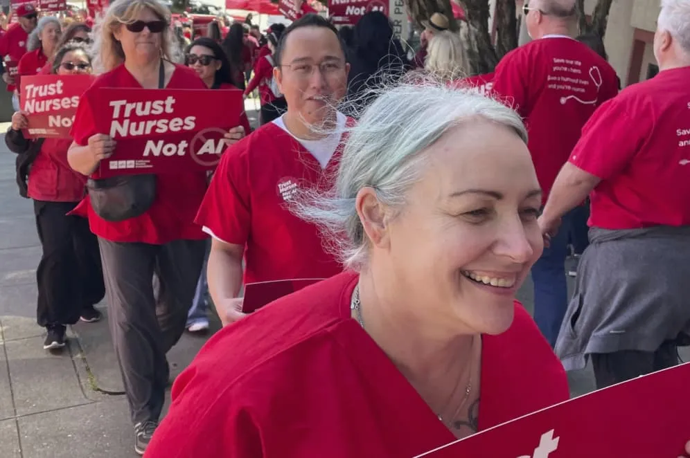 In-this-photo-provided-by-National-Nurses-United-Melissa-Beebe-foreground-and-other-nurses-hold-a-rally-in-San-Francisco-on-April-22-2024-to-highlight-safety-concerns-about-using-artificial-intell In-this-photo-provided-by-National-Nurses-United-Melissa-Beebe-foreground-and-other-nurses-hold-a-rally-in-San-Francisco-on-April-22-2024-to-highlight-safety-concerns-about-using-artificial-intell