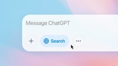 ChatGPT interface: Search button with globe icon, plus button, and three-dot menu. Pale blue and pink gradient background.