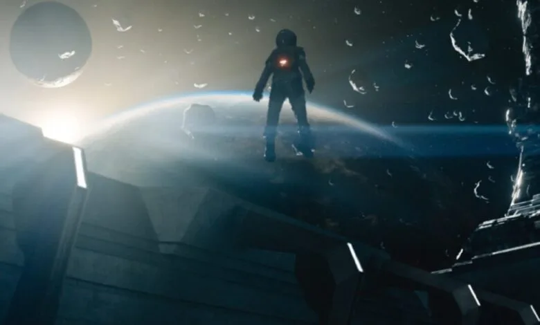 A lone astronaut stands on a space station overlooking Earth and a distant moon, debris floating in space around them.