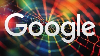 Google logo in white, overlaid on a colorful spiderweb. Represents Google's vast online reach.