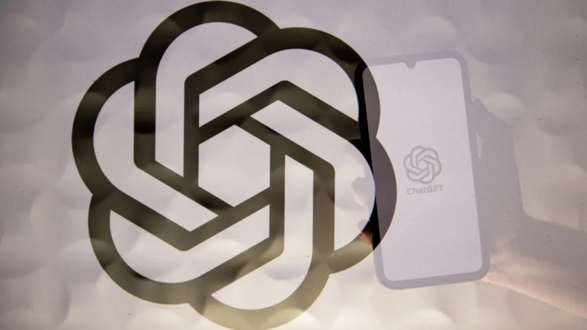 Smartphone displaying the ChatGPT logo layered over an abstract geometric design. AI and technology concept.