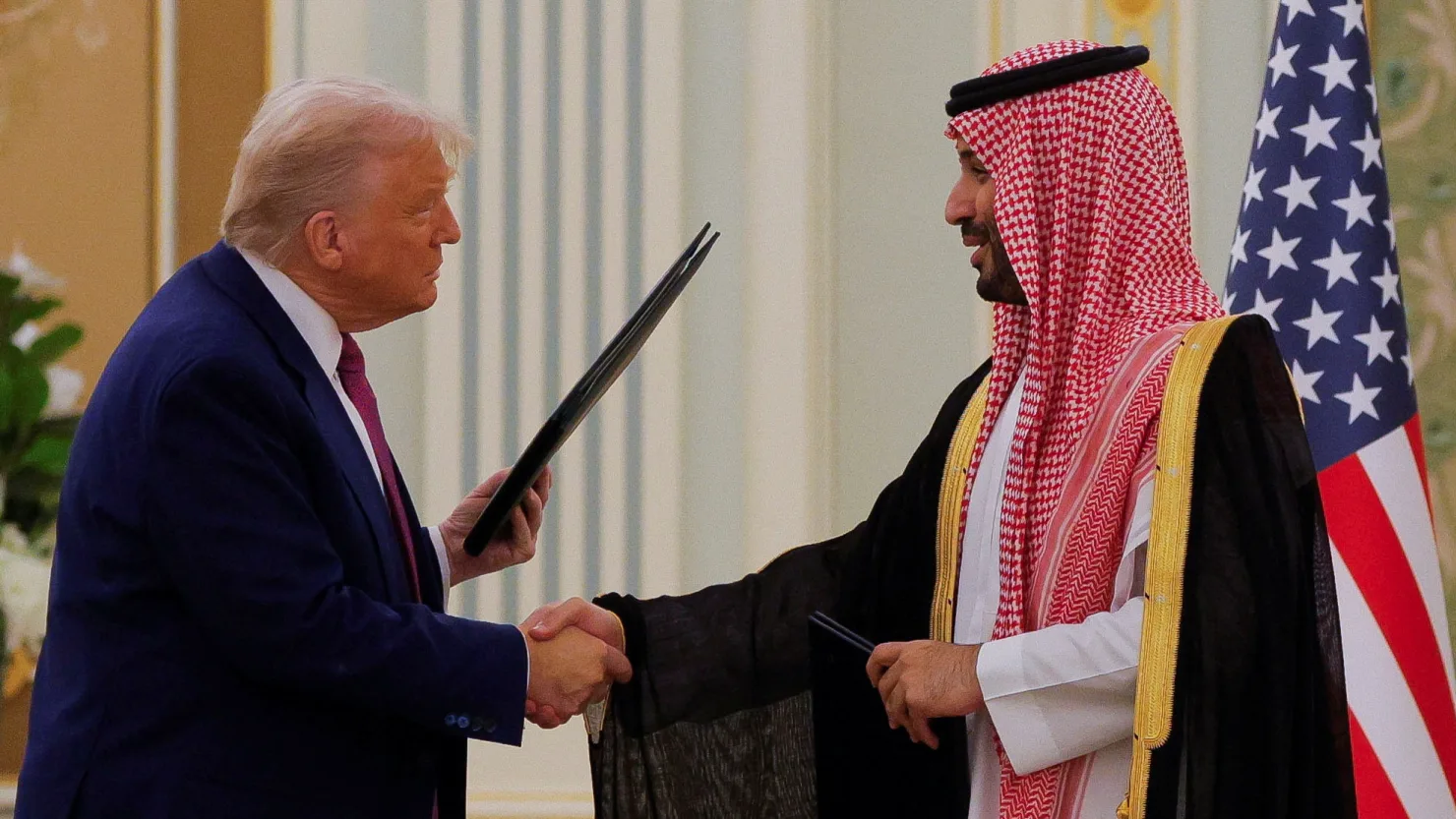 U.S. President Donald Trump and Saudi Crown Prince Mohammed Bin Salman shake hands during a Memorandum of Understanding signing ceremony at the Royal Court in Riyadh, Saudi Arabia, on May 13, 2025.
