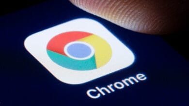 Close-up of a finger about to tap the Google Chrome app icon on a smartphone.