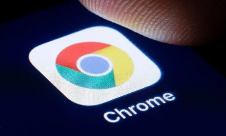 Close-up of a finger about to tap the Google Chrome app icon on a smartphone.