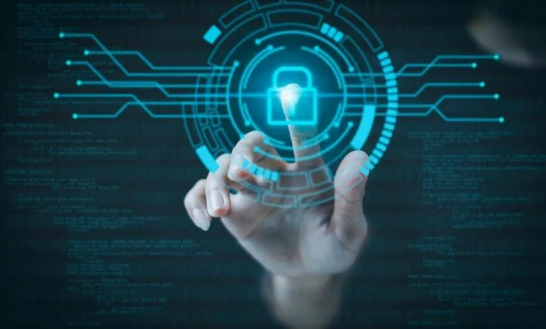 A hand interacts with a glowing digital interface, activating a padlock icon symbolizing cybersecurity and data protection.
