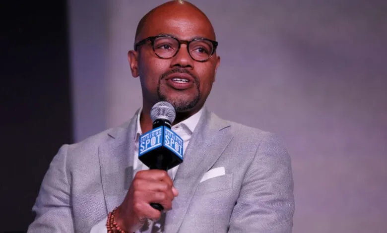 Nasir Qadree, a speaker at AFROTECH Executive in Washington, D.C., holds a microphone and speaks.