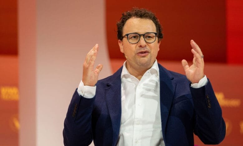 Dario Amodei, Anthropic CEO, speaks passionately at VivaTech 2024 in Paris, gesturing with both hands.