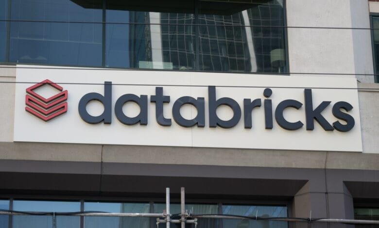 Databricks logo on a modern building. Black and red logo on a white background.