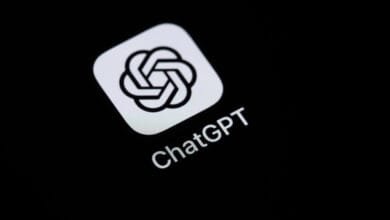 Close-up of the ChatGPT app icon and name on an iPhone. The icon is a white stylized knot on a black square.