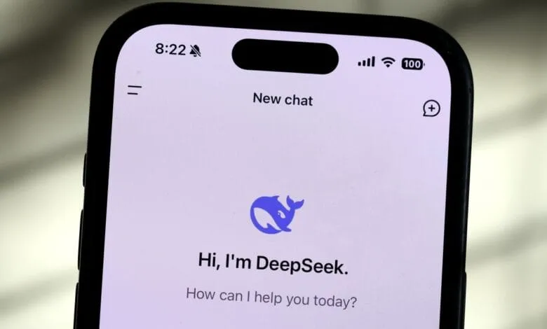 iPhone screen displaying the DeepSeek AI chatbot interface. A blue whale logo and the message 'Hi, I'm DeepSeek. How can I help you today?' are shown.