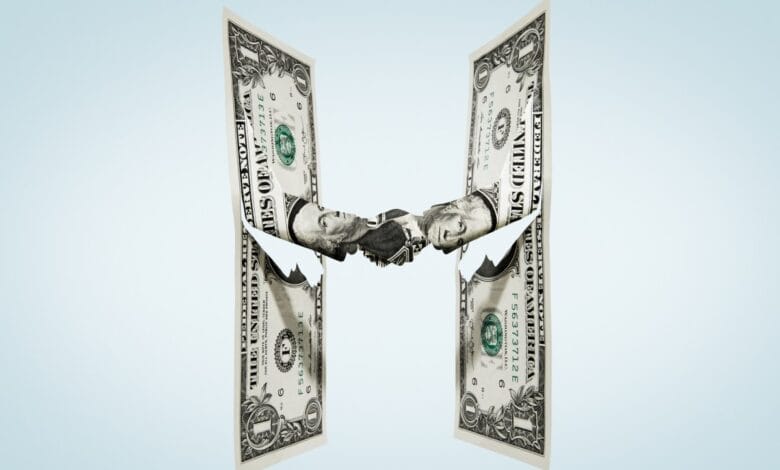 Two one-dollar bills form hands shaking against a light blue background, symbolizing financial agreements or partnerships.