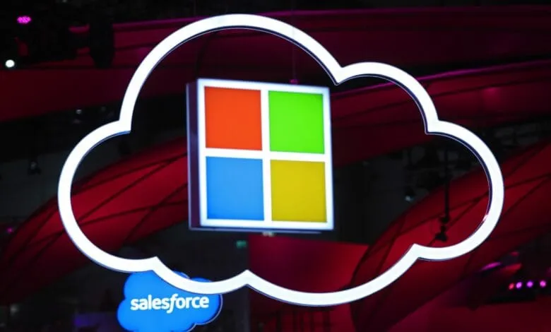 Microsoft and Salesforce logos on a glowing cloud against a dark red background, symbolizing their tech partnership.