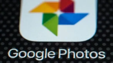 Close-up of the Google Photos app icon and text on a digital screen.