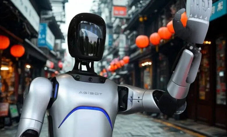 An AgiBot humanoid robot waves its hand at a China Yongda Automobiles Services Holdings Ltd car dealership in Shanghai China