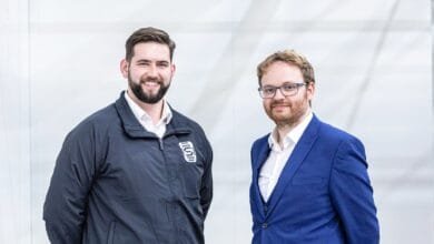 Joshua Western, CEO, and Andrew Bacon, CTO, of Space Forge, stand together smiling.