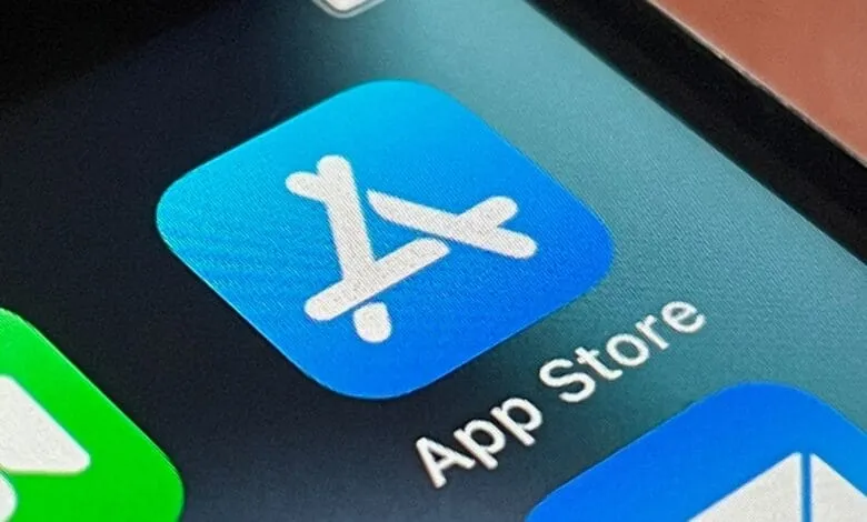 Close-up of the App Store icon on an iPhone; a bright blue square with a stylized white 'A'.