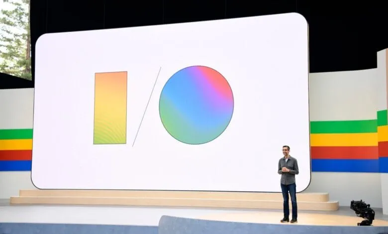 A man presents at Google I/O; a large screen displays the Google I/O logo.