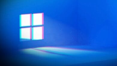 Stylized Windows 11 logo with glitch effect; pink and teal outlines on a deep blue background.