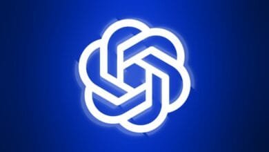 Abstract logo: A bright white, geometric flower-like design on a deep blue background.