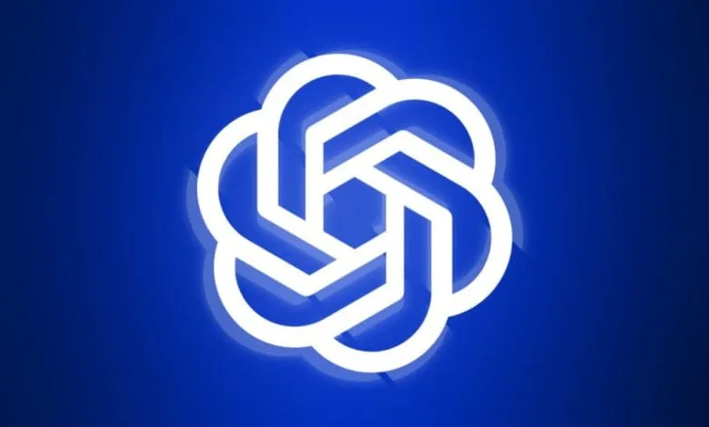 Abstract logo: A bright white, geometric flower-like design on a deep blue background.