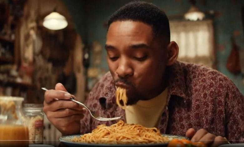 Will Smith enjoys a large plate of spaghetti in a cozy, vintage-style kitchen.