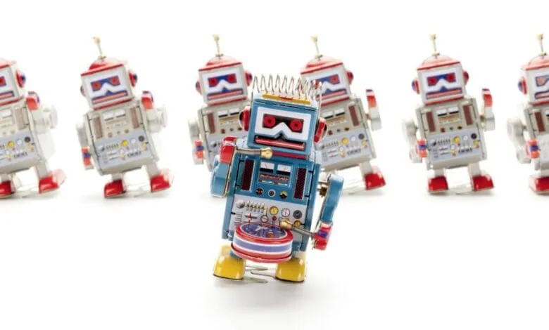 A line of vintage tin robots, one playing a drum, stands out from the others.