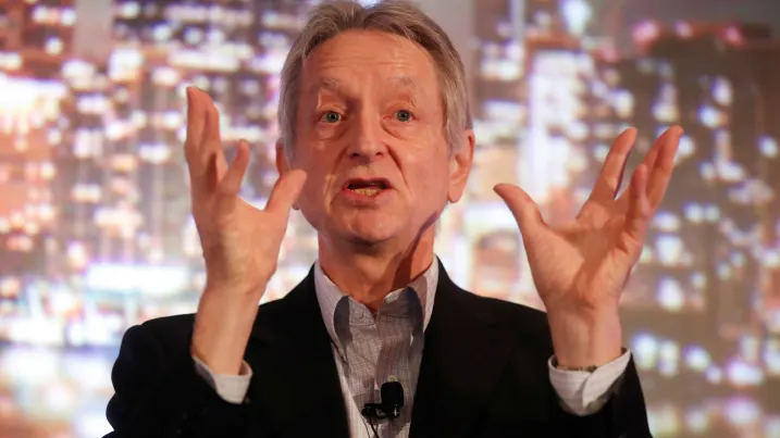 Geoffrey Hinton, a pioneer in artificial intelligence, passionately gestures while speaking.