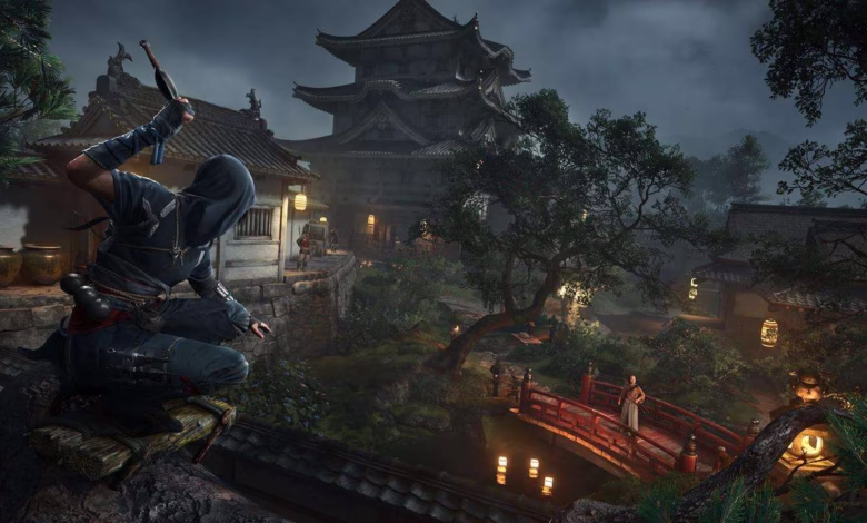 A hooded figure, possibly a ninja, crouches on a rooftop overlooking a serene Japanese village at twilight. A red bridge spans a calm pond.