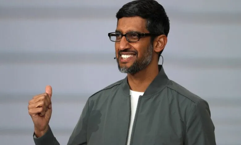 Sundar Pichai, CEO of Google, smiles and gives a thumbs-up.