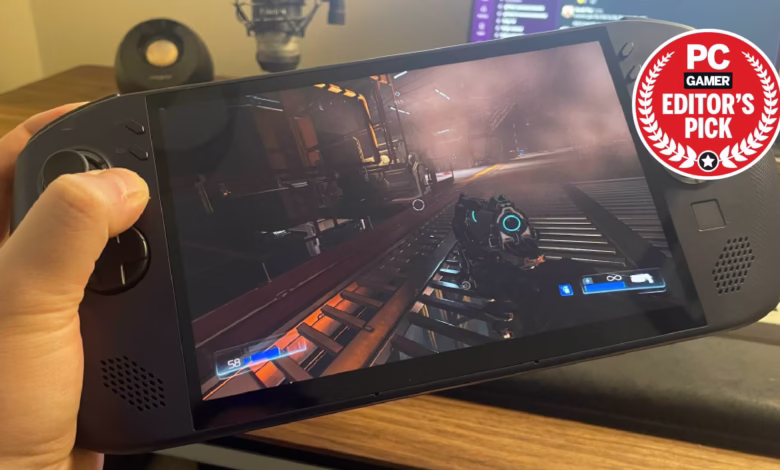 Handheld gaming device displaying a first-person shooter game, labeled 'PC Gamer Editor's Pick'.