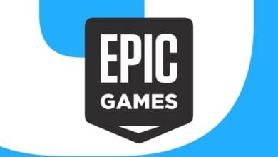Epic Games logo: White 'EPIC GAMES' on a dark gray shield shape against a blue and white background.