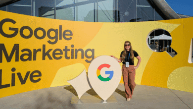 Brooke Osmundson smiles at Google Marketing Live event, posing by large yellow Google logo.