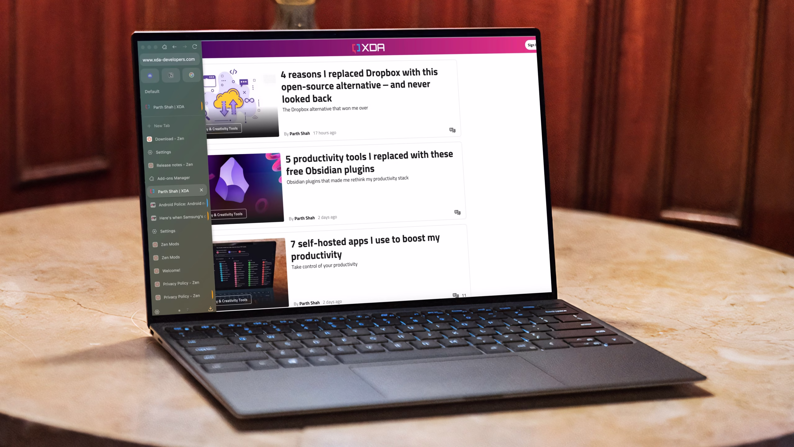 Laptop displaying XDA Developers articles on productivity tools and self-hosted apps. Articles by Parth Shah.