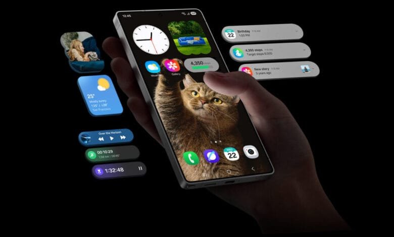 Hand holding smartphone displaying cat photo, weather, step count, and music player widgets. Notifications and other app icons are visible.