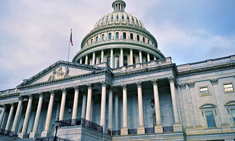Low-angle view of the US Capitol building in Washington, D.C., showcasing its iconic dome and classical architecture.