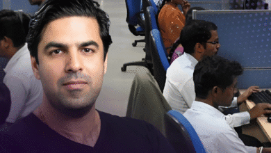 A man's portrait superimposed on a busy office setting with employees working at computers.