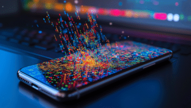 Smartphone screen displays vibrant, colorful code cascading from above, suggesting digital data flow and modern technology.
