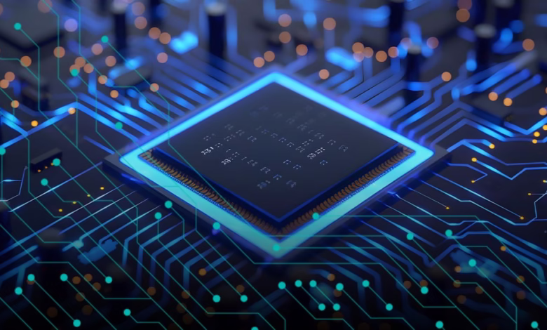 Close-up of a computer microchip glowing blue on a circuit board, showcasing intricate circuitry.