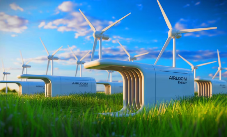 Rows of sleek, white Airloom Energy wind turbines stand in a grassy field under a bright, blue sky.